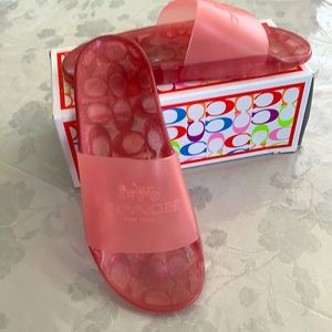 Coach Ulysses Slides in candy apple pink. Size 8